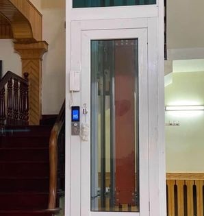 Giá của loại thang máy gia đình cửa mở tay